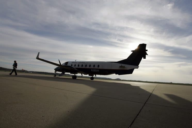 A pilot for Great Lakes Airlines walks away from her plane after landing at Cape Girardeau Regional Airport on March 25, 2009, in Cape Girardeau, Mo. (Photo: Jeff Roberson/AP)