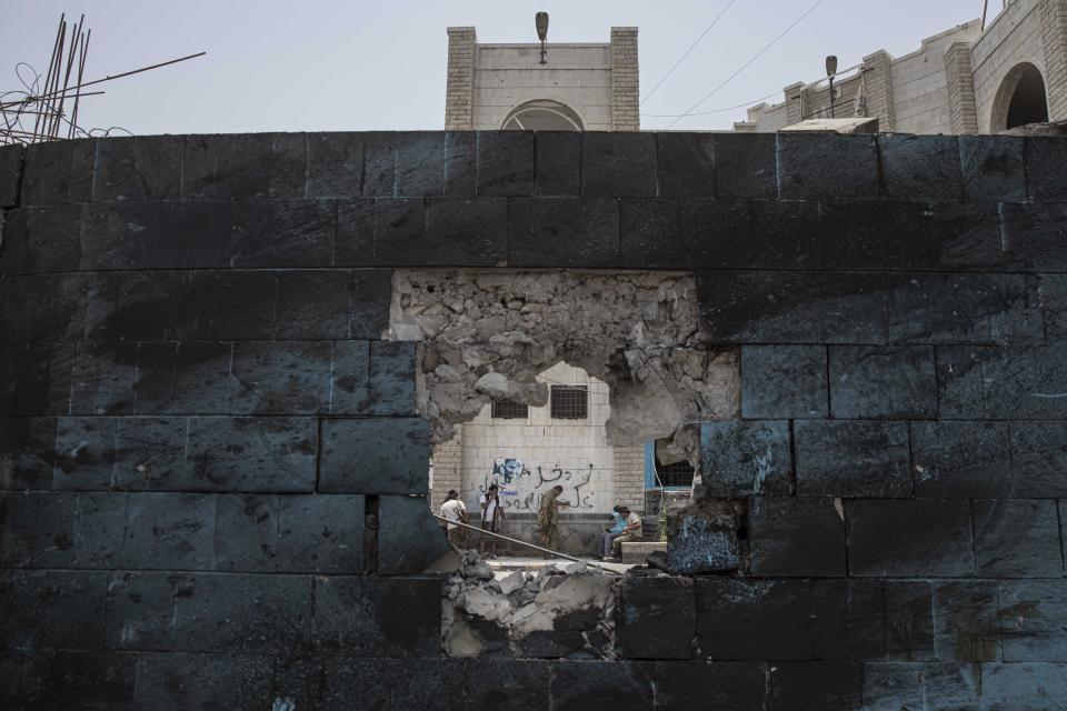 Soldiers guard the site of a deadly attack inside the Sheikh Othman police station in Aden, Yemen, Thursday, Aug. 1, 2019. Yemen's rebels fired a ballistic missile at a military parade Thursday in the southern port city of Aden as coordinated suicide bombings targeted the police station in another part of the city. The attacks killed over 50 people and wounded dozens. (AP Photo/Nariman El-Mofty)