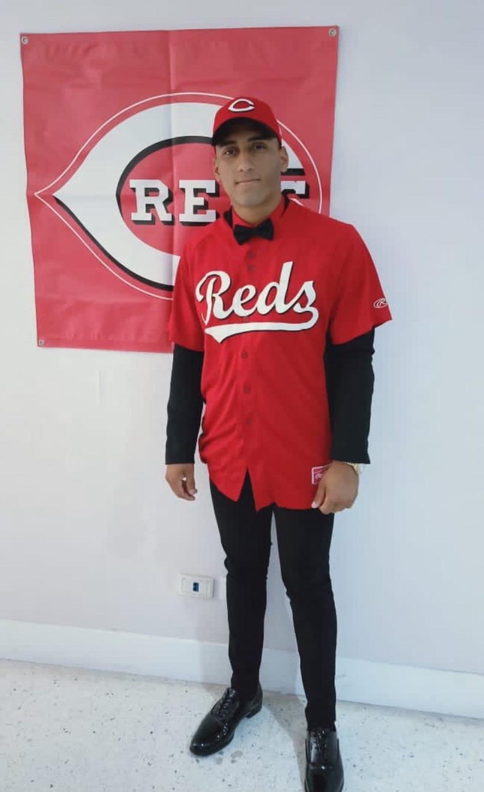 Venezuelan shortstop Ricardo Cabrera poses for a picture after signing a contract with the Cincinnati Reds on Jan. 15, 2022. He's rated as the No. 3 overall player in the 2021-22 international signing class by Baseball America.