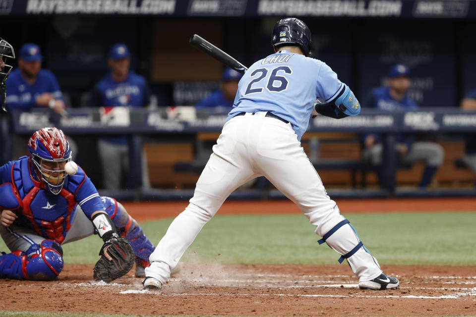 Toronto Blue Jays catcher Alejandro Kirk reaches for a wild pitch thrown to Tampa Bay Rays' Ji-Man Choi during the sixth inning of a baseball game, Sunday, May 15, 2022, in St. Petersburg, Fla. (AP Photo/Scott Audette)