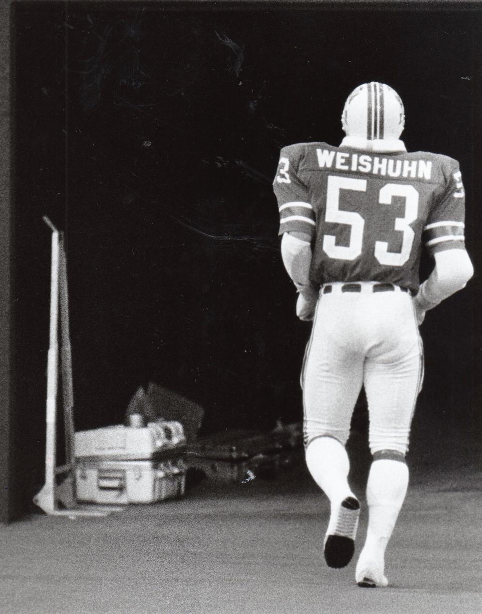 Wall High School graduate Clayton Weishuhn runs into the locker room during a game with the New England Patriots in this undated file photo from the San Angelo Standard-Times.