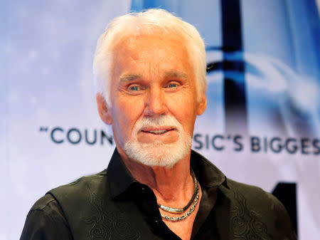 FILE PHOTO: Kenny Rogers poses backstage after accepting the Willie Nelson Lifetime Achievement award at the 47th Country Music Association Awards in Nashville, Tennessee November 6, 2013. REUTERS/Eric Henderson/File Photo