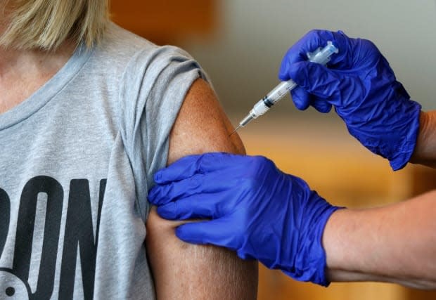 Public health officials say in keeping with NACI guidance, people can now receive the second dose of a COVID-19 vaccine 28 days after the first. (Nathan Papes/The Springfield News-Leader/The Associated Press - image credit)