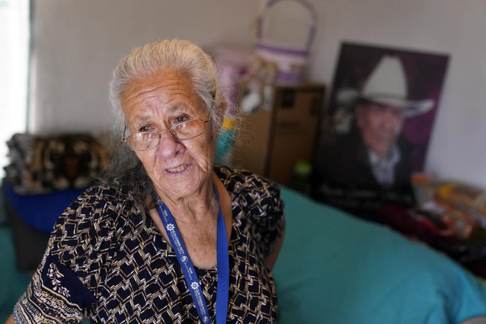 Maria Quintero stands inside the apartment she shares with her son J.J. in Calipatria, Calif., near the Salton Sea, Friday, July 16, 2021. Quintero moved to the region from Mexicali, Mexico, in the early 1960s with her husband Agustin, who was a bracero, or a seasonal migrant farm worker. The Salton Sea, California's largest but rapidly shrinking lake, has been through decades of economic stagnation. Now, it's at the forefront of efforts to make the U.S. a major global producer of lithium, the ultralight metal used in rechargeable batteries. (AP Photo/Marcio Jose Sanchez)