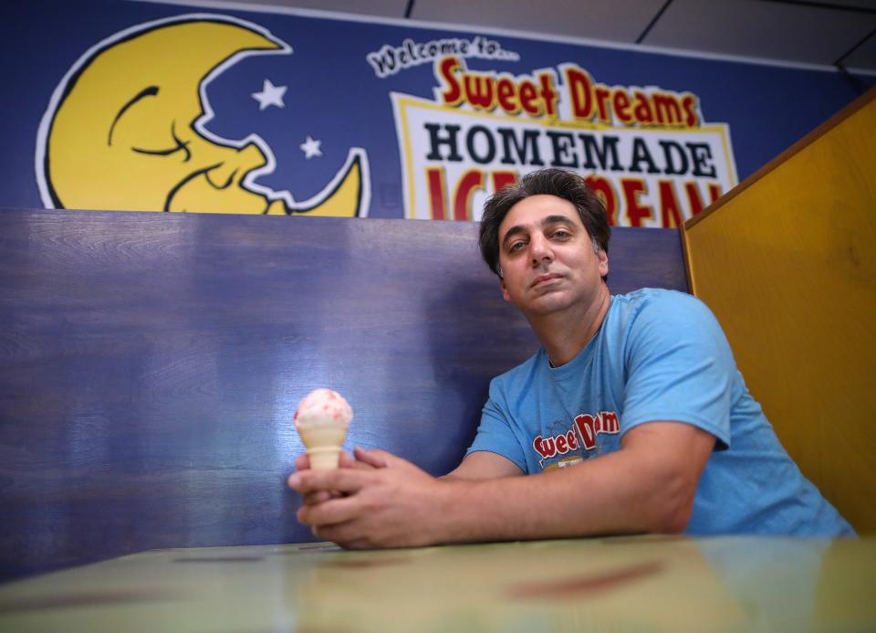 Mike Manfredi, the owner of Sweet Dreams Homemade Ice Cream, has been in business in Gainesville for 17 years. He sits in one of the booths at the store, which has not officially opened regular hours because of the after-effects of COVID-19 on the economy, on May 4, 2021.