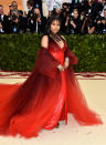 <p>Nicki brought drama to the red carpet in this Moschino deep red gown. Photo: Getty Images </p>