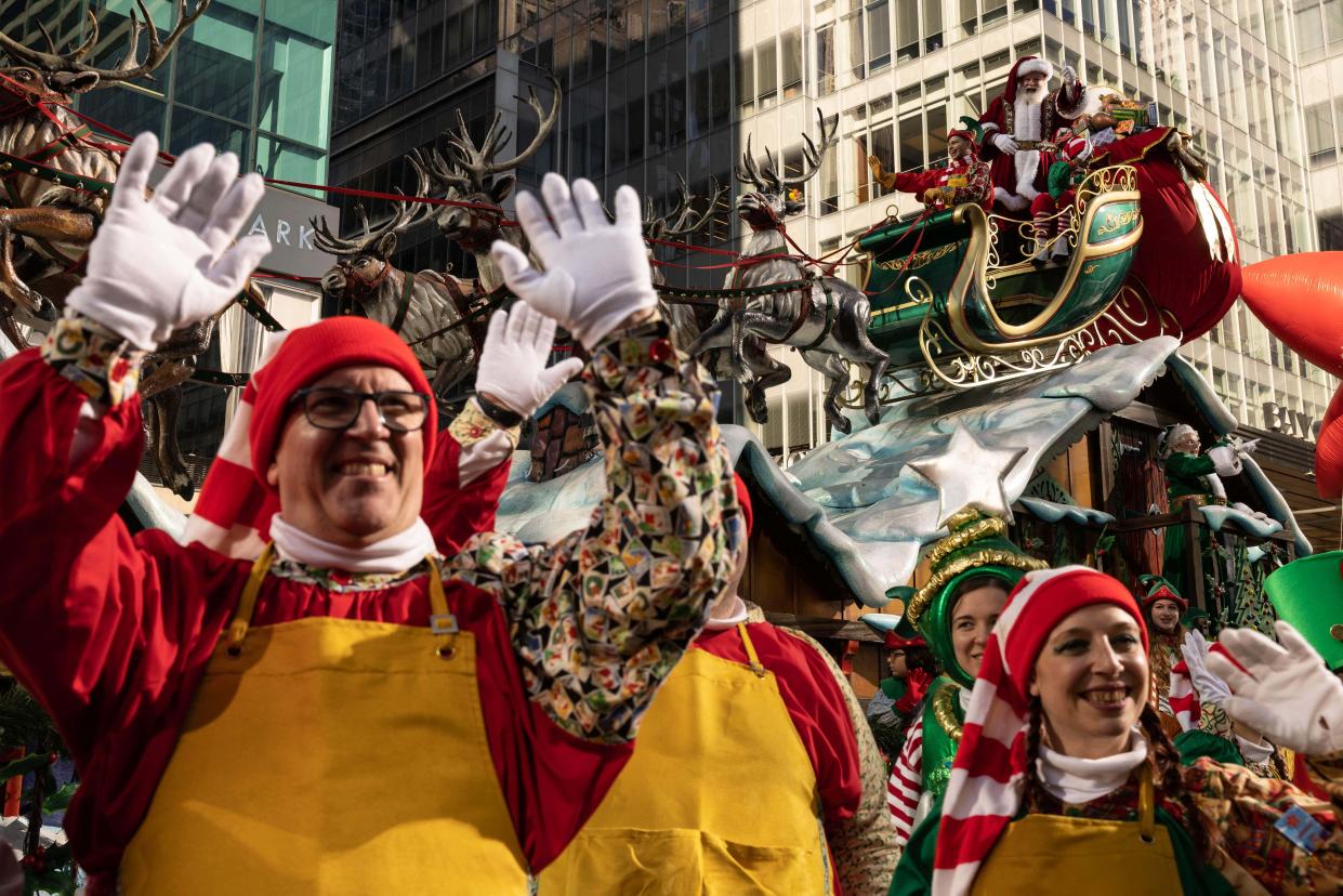 The Santa Claus float, complete with reindeer and elves.  (Yuki Iwamura / AFP via Getty Images)