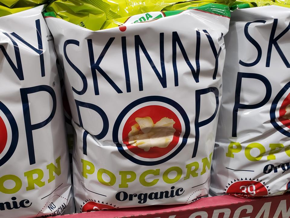 bags of skinnypop popcorn on display at costco