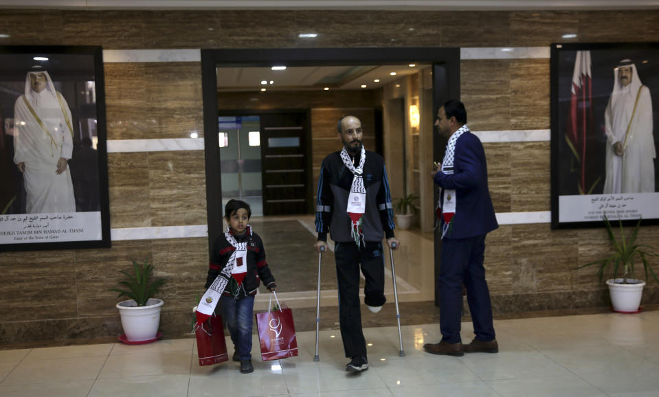 A Palestinian patient walks in the hall after the opening ceremony of H. H. Sheikh Hamad bin Khalifa Al Thani Hospital for Rehabilitation and Artificial Limbs in Gaza City, Monday, April 22, 2019. Qatar built the hospital after its then-emir visited Gaza in 2012, but a lack of qualified staff and funding prevented Hamas from operating the center. (AP Photo/Adel Hana)