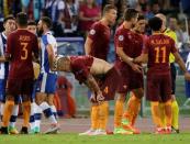 Football Soccer - AS Roma v FC Porto - UEFA Champions League Qualifying Play-Off Second Legs - Olympic stadium, Rome, Italy - 23/8/2016. AS Roma's players surround referee Szymon Marciniak of Poland during the match against FC Porto. REUTERS/Max Rossi