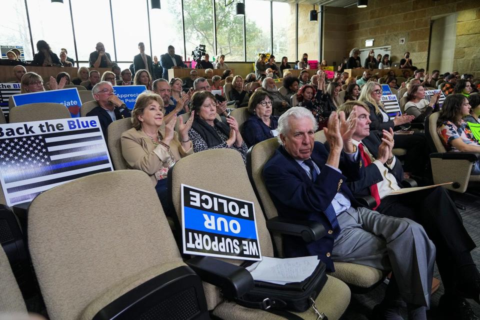 Supporters of a four-year contract for the Austin Police Department attend an Austin City Council meeting Feb. 15. The council and the police union are at odds on extending the current police contract.