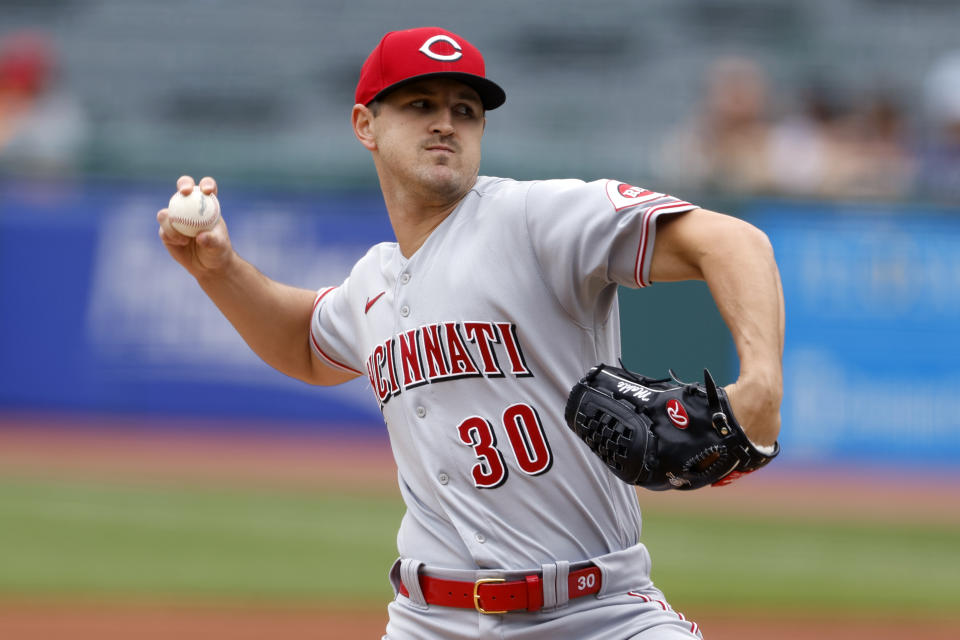 Cincinnati Reds starting pitcher Tyler Mahle throws against the Cleveland Guardians during the first inning of a baseball game, Thursday, May 19, 2022, in Cleveland. (AP Photo/Ron Schwane)