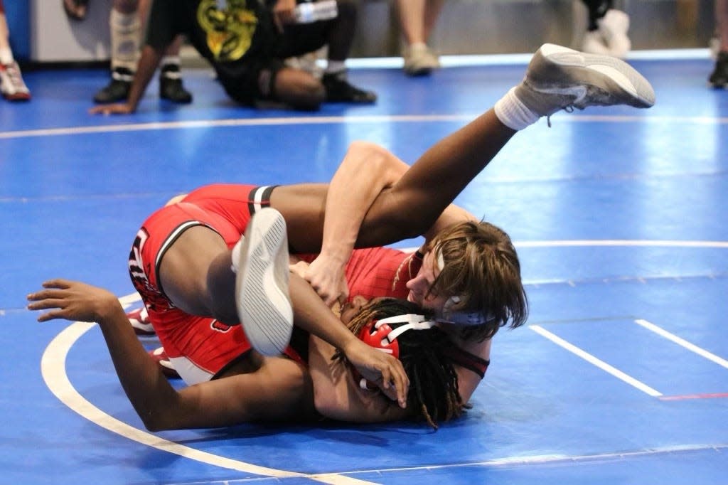 Senior Lake Gibson wrestler Colt Brown attempts to pin an opponent in the county duals on Saturday, Dec. 17, 2022, at Mulberry High School.