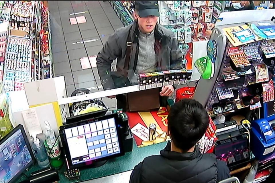 CCTV image taken from a Texaco petrol station showing suspect George Goddard topping up a mobile phone,  which was shown to the jury in the Mark Cavendish robbery case at Chelmsford Crown Court. (PA)