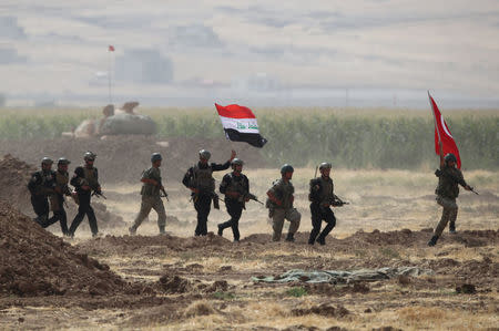 Turkish and Iraqi troops are pictured during a joint military exercise near the Turkish-Iraqi border in Silopi, Turkey, September 26, 2017. REUTERS/Umit Bektas