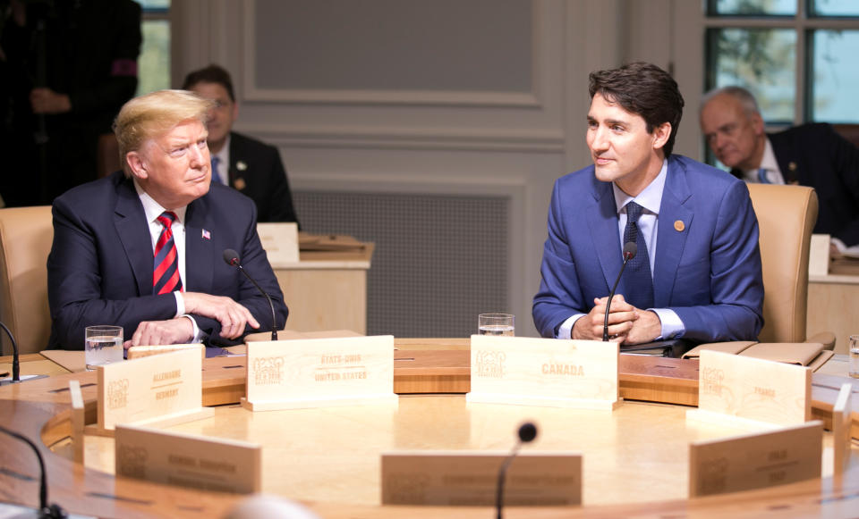 Justin Trudeau and President Trump participate in the working session at the G7 summit on Friday. (Photo: Christinne Muschi/Reuters)