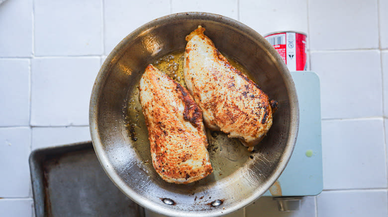 Browned chicken in saute pan