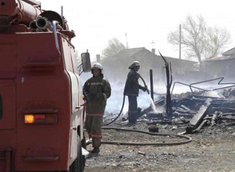 This photo obtained from Russia's Emergency Ministry on April 12, 2015 shows firefighters extinguishing a fire in the region of Khakassia in southeastern Siberia