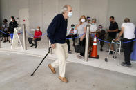 FILE - In this Jan. 27, 2021, file photo, people stand in line to receive the Pfizer COVID-19 vaccine at the Jackson Hospital in Miami. COVID-19 hospitalizations are plunging among older Americans. The falling numbers show the country’s vaccination strategy is working, pushing deaths lower and easing pressure on the frayed hospital system. (AP Photo/Lynne Sladky, File)