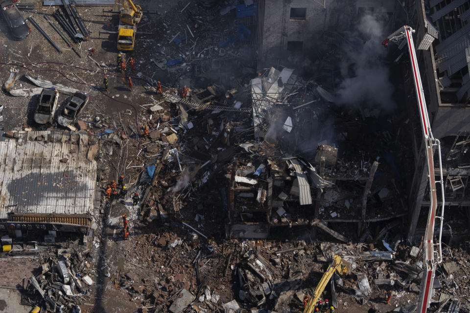 Firefighters work the scene of an explosion in Sanhe city in northern China's Hebei province on Wednesday, March 13, 2024. Rescuers were responding to a suspected gas leak explosion Wednesday in a building in northern China, authorities said. (AP Photo/Ng Han Guan)