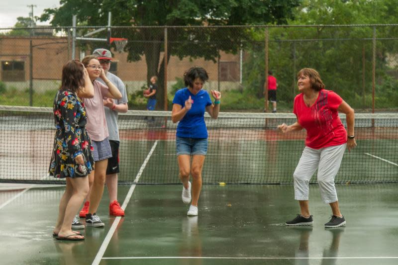 Despite some rain, Carrie Williams, Skye Loffreda, Alex Loffread and Cole Loffreda enjoy a 2019 Court Dance to celebrate the 71st birthday of Marlene Cunningham (in red).
A Court Dance will take place June 7 at St. Mary's Park tennis courts.
Monroe News file photo by Tammy Massingill