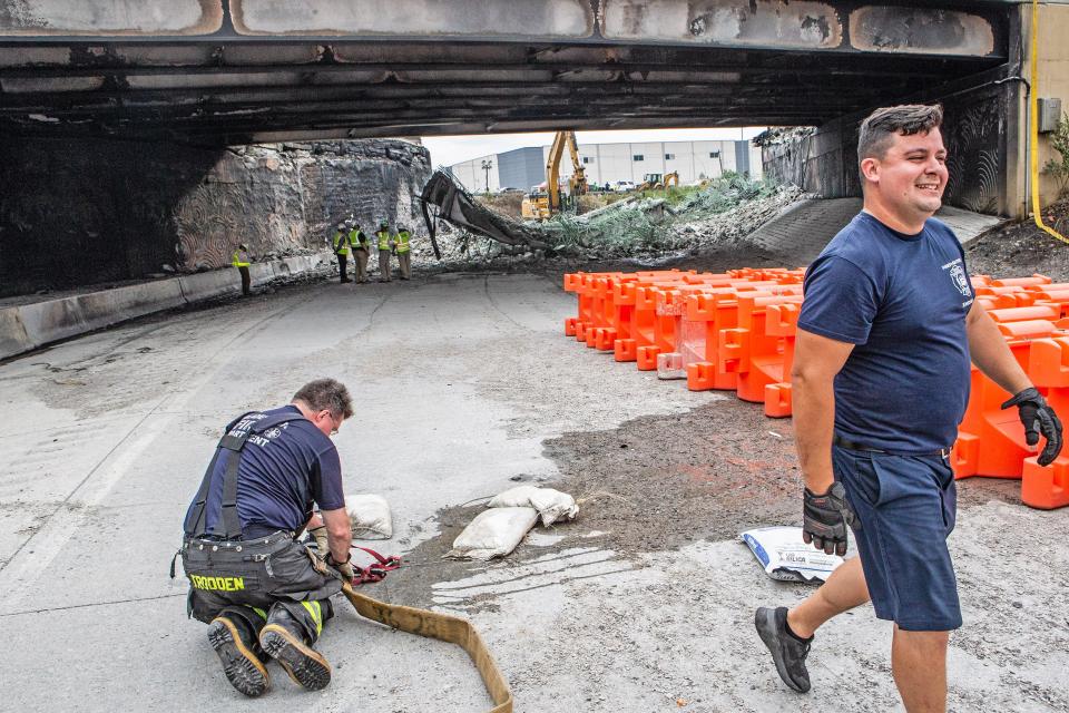 Members of the Philadelphia Fire Department work at the site of the collapsed section of Route 95 northbound over Cottman Avenue in Philadelphia, PA, on Monday, June 12, 2023. The section of the I-95 interstate highway collapsed after a vehicle fire broke out beneath an overpass.