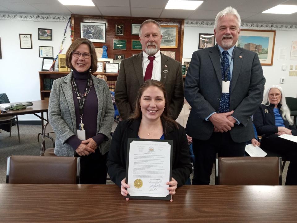 The Wayne County commissioners named April 2024 Child Abuse Prevention Month, to raise awareness. Seated is Roz Burke, director of Wayne County Children & Youth Services. Standing from left are Commissioners Joceyln Cramer, chairperson Brian Smith and James Shook.