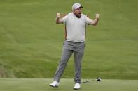 Team Europe's Shane Lowry celebrates on the 18th hole after makes a putt and winning their four-ball match the Ryder Cup at the Whistling Straits Golf Course Saturday, Sept. 25, 2021, in Sheboygan, Wis. (AP Photo/Charlie Neibergall)