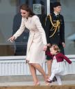 Catherine Duchess of Cambridge guides Princess Charlotte as they depart Victoria and wrap up their tour of Canada’s west coast. Photo: REX/Shutterstock