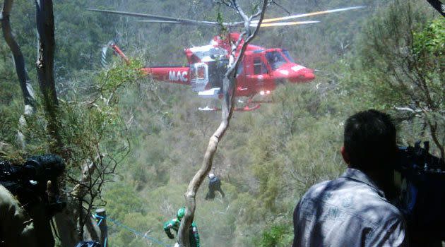 7News: The rescue helicopter begins to airlift the injured climber to safety, at Morialta Conservation Park.