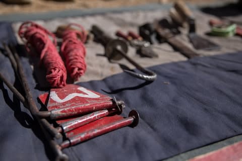 Demining equipment lies on a blanket in Bamyan province  - Credit: Stefanie Glinski&nbsp;