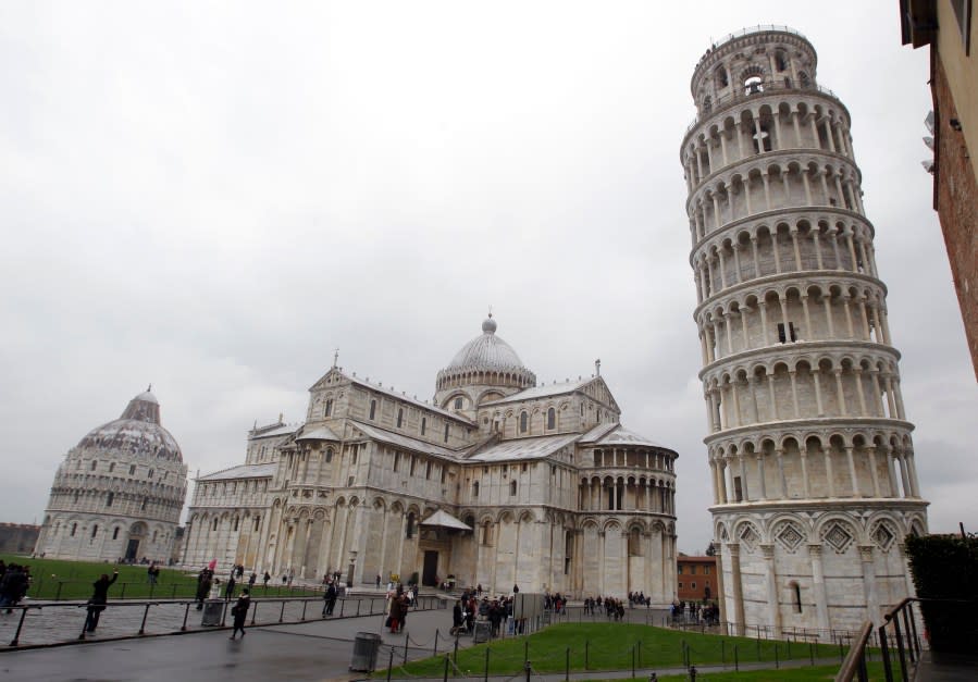 The Leaning Tower of Pisa (Torre di Pisa) is seen at right next to the medieval cathedral of Pisa, in Piazza dei Miracoli Square, in Pisa, Italy, Sunday, Jan. 2, 2012. On Thursday, Nov. 22, 2018, after more than two decades of efforts to straighten it, engineers say the famed Tuscan bell tower has recovered four centimeters (1.57 inches) and is in better structural health than predicted. (AP Photo/Luca Bruno)