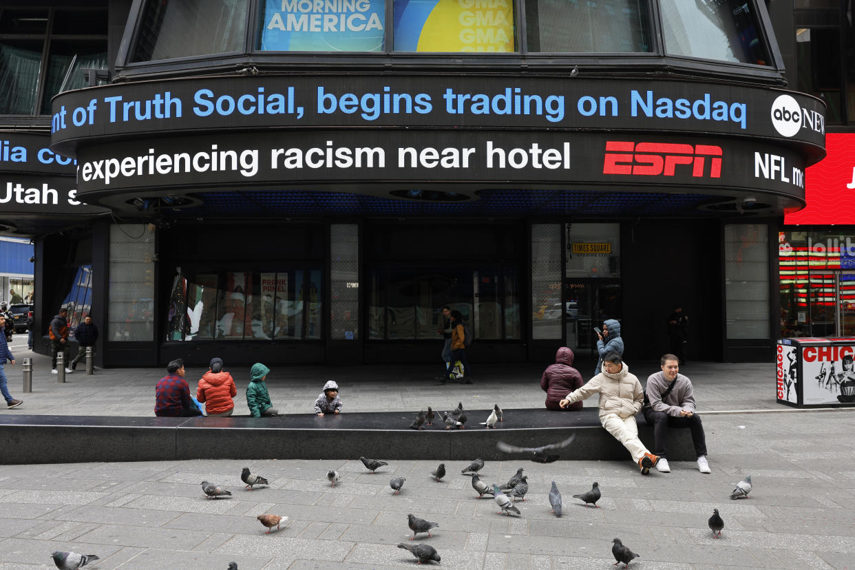 NEW YORK, NEW YORK - MARCH 26: News of Trump Media & Technology Group public trading is seen displayed in Times Square on March 26, 2024 in New York City. Trump Media & Technology Group, the owner of struggling social media platform Truth Social owned by former President Donald Trump, began trading as a public company at Nasdaq's opening bell under the ticker symbol “DJT.” The stock rose about 50% at the market open. (Photo by Michael M. Santiago/Getty Images)