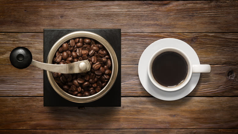 beans in manual coffee grinder