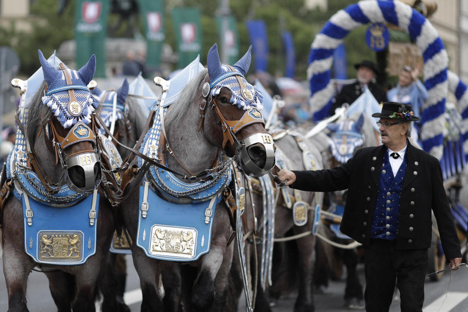 <p>A ‘Hofbraeu’ brewery coach takes part in the the traditional costume and riflemen parade. (AP Photo/Matthias Schrader) </p>