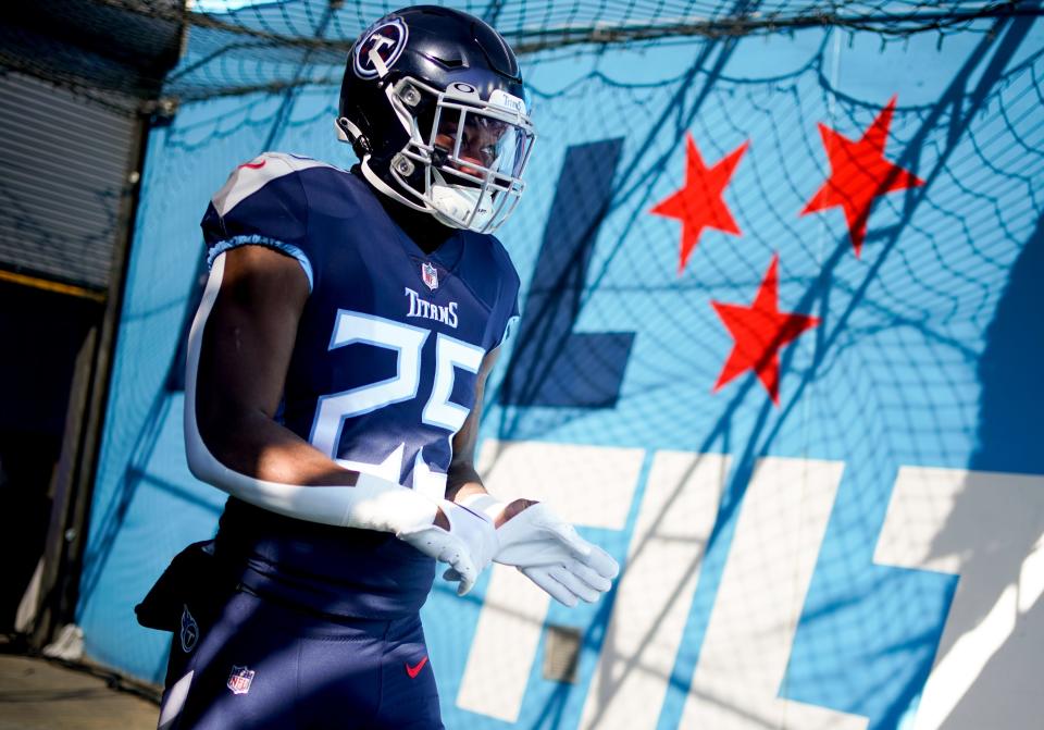 Tennessee Titans running back Hassan Haskins (25) heads to the field before facing the Houston Texans in a December game.