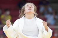 Distria Krasniqi of Kosovo reacts after competing against Funa Tonaki of Japan during their women's -48kg championship judo match at the 2020 Summer Olympics, Saturday, July 24, 2021, in Tokyo, Japan. (AP Photo/Vincent Thian)