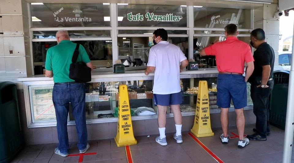 People line up for Cuban coffee at Versailles restaurant in Miami’s Little Havana on Saturday, April 17, 2021.