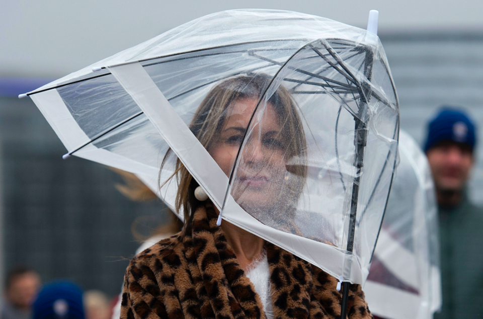 <em>A women with her umbrella in the wind on Westminster Bridge as Storm Diana struck (PA)</em>