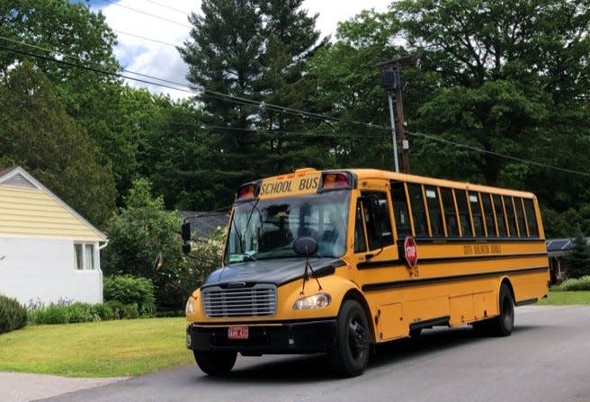 A South Burlington school bus makes its way around Brewer Parkway on June 1, 2020.