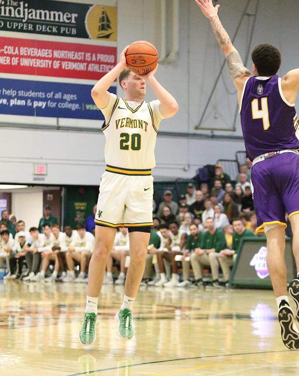 Vermont's TJ Long lines up a 3-pointer during the Catamounts 75-72 win over Albany in the America East quarterfinals on Saturday afternoon at UVM's Patrick Gym.