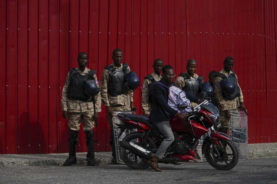 Police stand guard outside the Prime Minister's office in Port-au-Prince, Haiti, Thursday, April 25, 2024. A transitional council tasked with selecting a new prime minister and cabinet is expected to be sworn in on Thursday. (AP Photo/Ramon Espinosa)