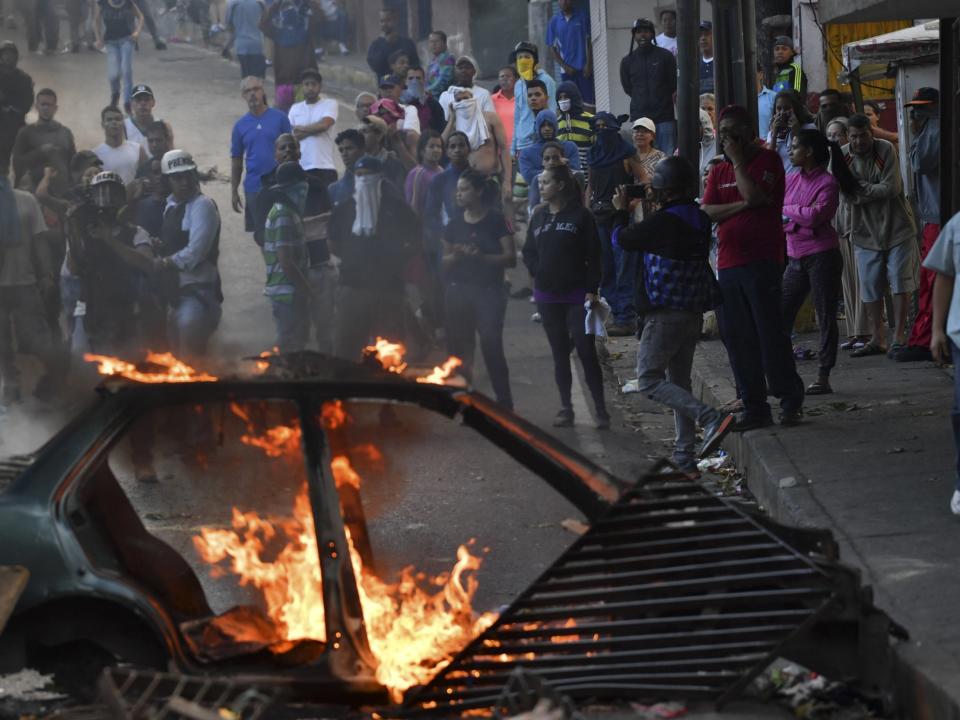 Venezuela security forces fire tear gas at protesters after 'uprising by military unit' in Caracas