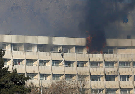 A man tries to escape from a balcony at Kabul's Intercontinental Hotel during an attack by gunmen in Kabul, Afghanistan January 21, 2018. REUTERS/Omar Sobhani/Files