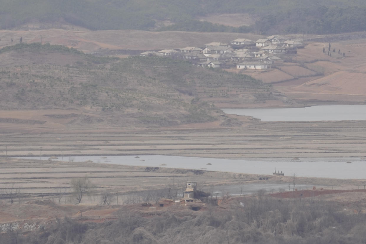 A field of North Korea's Kaepoong town is seen from the Unification Observation Post in Paju, South Korea, Tuesday, March 14, 2023. North Korea test-fired two short-range ballistic missiles in another show of force Tuesday, a day after the United States and South Korea began military drills that Pyongyang views as an invasion rehearsal. (AP Photo/Lee Jin-man)