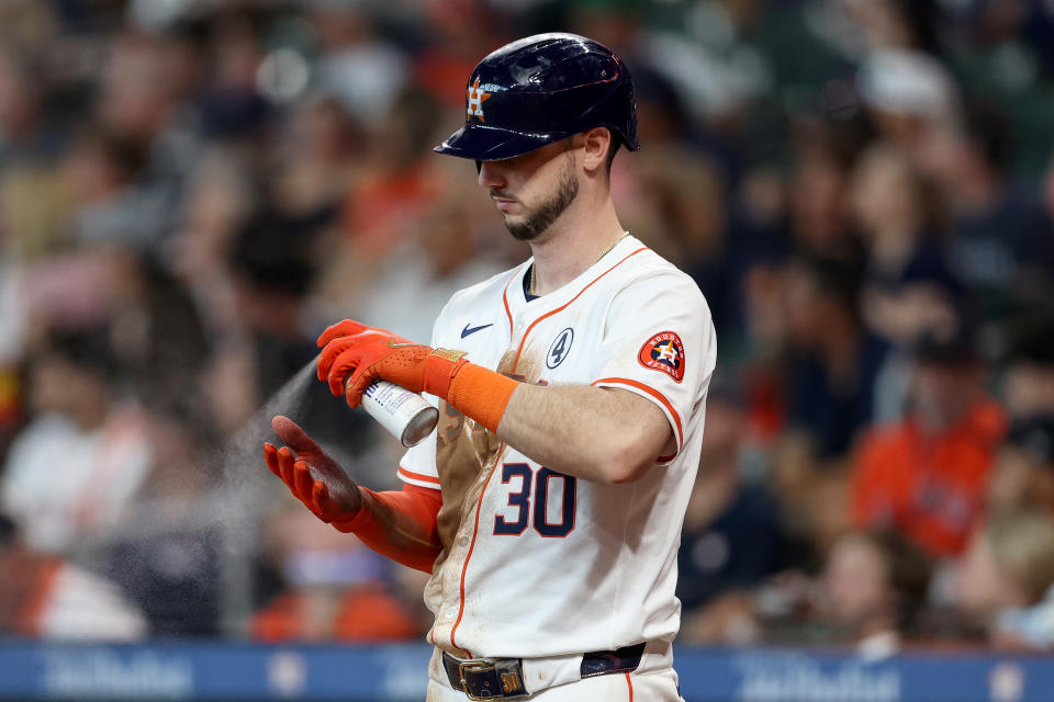 HOUSTON, TEXAS - JUNE 02: Kyle Tucker #30 of the Houston Astros applies grip spray to his batting gloves in the fifth inning against the Minnesota Twins at Minute Maid Park on June 02, 2024 in Houston, Texas. (Photo by Tim Warner/Getty Images)