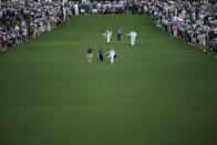 Sepp Straka, of Austria, Phil Mickelson and Tony Finau walk on the first hole during the first round at the Masters golf tournament at Augusta National Golf Club Thursday, April 11, 2024, in Augusta, Ga. (AP Photo/Matt Slocum)