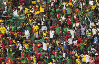Fans reacts after Cameroon's captain Vincent Aboubakar, scored his team's first goal, during the African Cup of Nations 2022 group A soccer match between Cape Verde and Cameron at the Olembe stadium in Yaounde, Cameroon, Monday, Jan. 17, 2022. (AP Photo/Themba Hadebe)