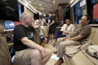 Ryan Hampton, founder of the Voices Project, left, talks with actor Danny Trejo, aboard the 2022 Mobile Recovery National Bus during a stop in Sacramento, Calif., Wednesday, Sept. 7, 2022. Trejo spoke at the recovery rally telling the crowd about his past problems with drug addiction. Across the country, people in recovery and relatives of those killed by opioid overdoses are pressing for roles in determining how billions in opioid settlement money will be used. That push is one of the missions of the monthlong nationwide bus tour. (AP Photo/Rich Pedroncelli)