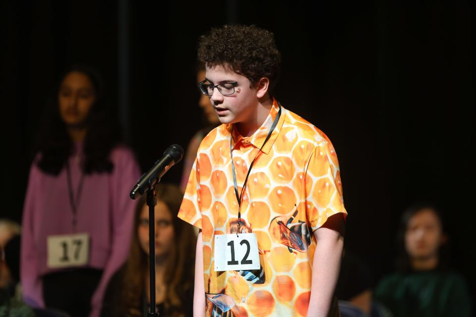 Zach Yeager spells a word during the second round of the Akron Beacon Journal Regional Spelling Bee. Zach went on to win the event.